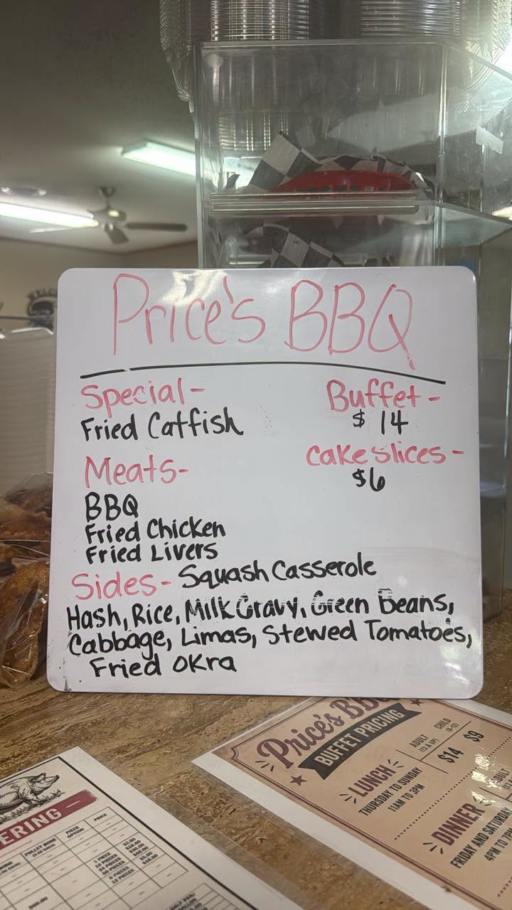 Handwritten buffet pricing board inside Price's BBQ